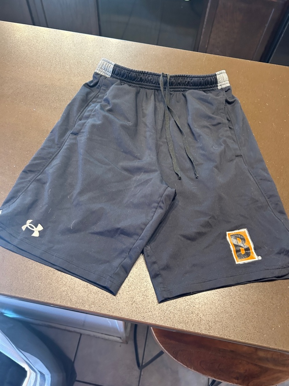 Under Armour Men's black Biggby AAA hockey shorts